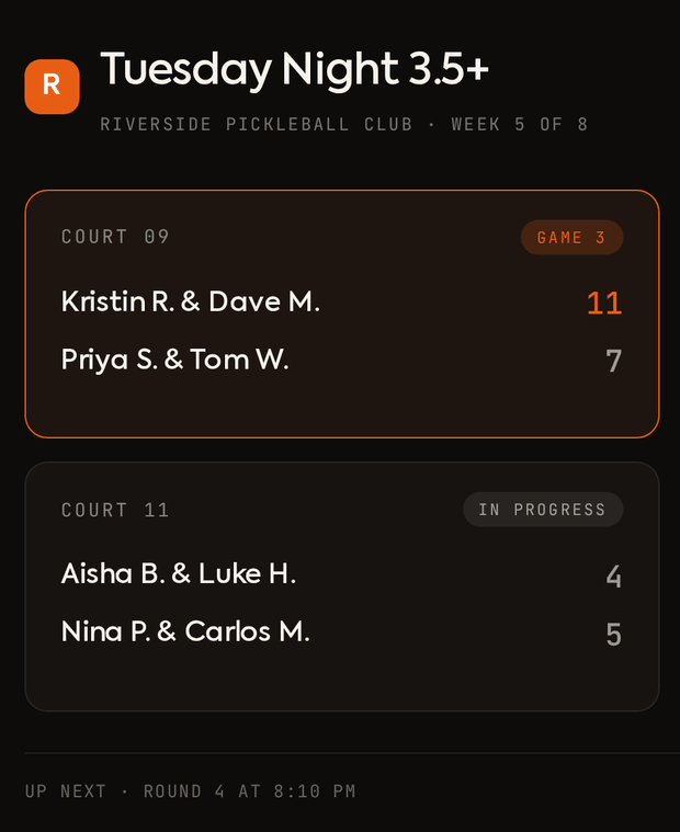A courtside TV showing live scores and standings